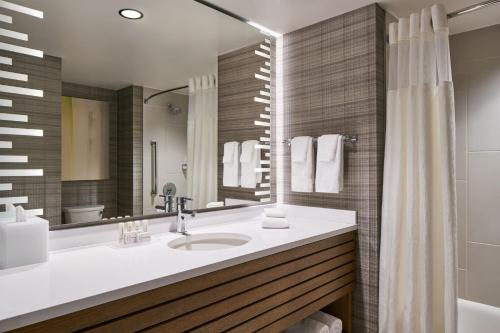 a bathroom with a sink and a mirror at Courtyard by Marriott Washington Downtown/Convention Center in Washington