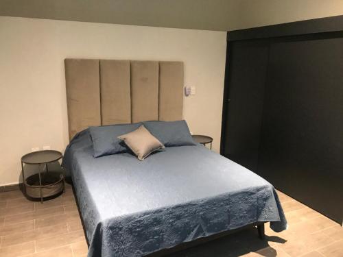 Ein Bett oder Betten in einem Zimmer der Unterkunft Monte San Andres Residencial