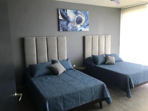 Ein Bett oder Betten in einem Zimmer der Unterkunft Monte San Andres Residencial