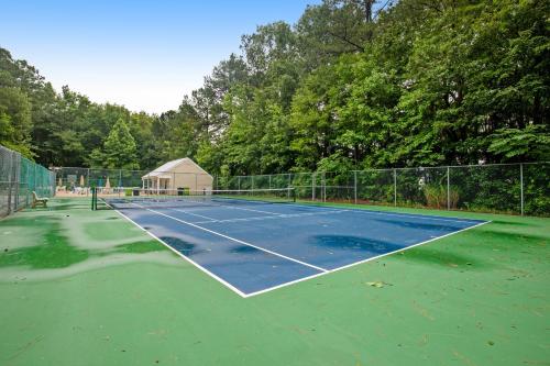 a tennis court with a tennis court at Clearwater --- 33959 Monterray in Frankford