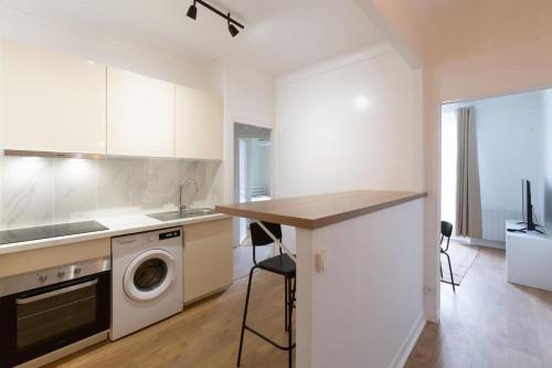 Kuchyň nebo kuchyňský kout v ubytování Appartement 3 pièces - Proche RER et centre ville