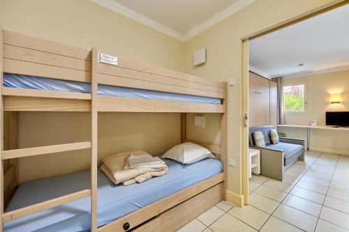 a room with two bunk beds in it at Citea Deauville - Tourisme & Vacances mer in Deauville
