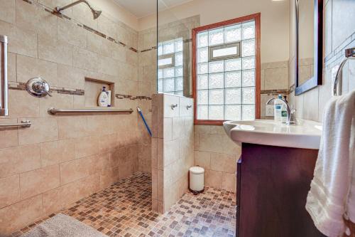 a bathroom with a sink and a shower at Pet-Friendly St Paul Home Less Than 5 Mi to Downtown! in Lilydale