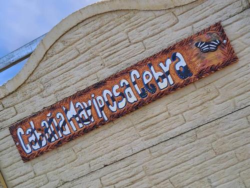 a sign on the side of a building at Cabaña Cebra - THE Spot for GREAT Sunset views! in Jardín