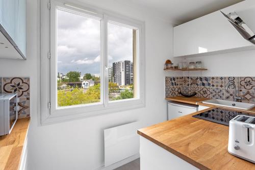Dapur atau dapur kecil di Studio Cosy - Au pied du tram - Parking - WIFI