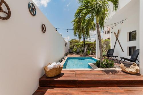 a pool in the backyard of a house at *CASA ALUXES- Guesthouse* in Cancún