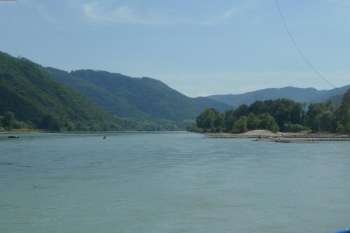 a view of a river with mountains in the background at Pension Marillenhof in Melk