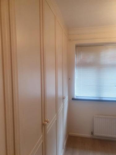 an empty room with a door and a window at Tavern Court Shared Facilities in Manchester