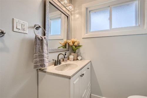 a bathroom with a sink and a mirror at Newly Furnished & Updated • 15 min to Denver in Northglenn