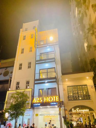 a building with aaps hotel in front of it at A25 Hotel - 14 Hồ Huấn Nghiệp in Ho Chi Minh City