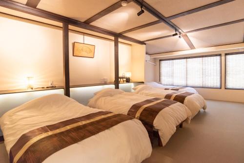 Llit o llits en una habitació de Kyoto Central Base