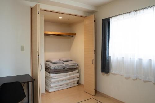 Postel nebo postele na pokoji v ubytování apartment hotel myu