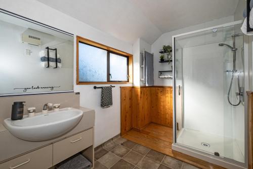 a bathroom with a sink and a shower at Rakaia Gorge Views - Mt Hutt in Windwhistle