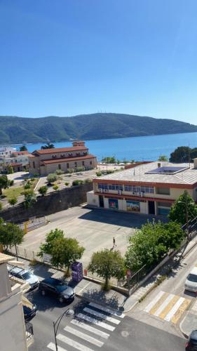 a city with a parking lot and a large building at Igoumenitsa heart flats to let Mariasroom studios appart seaside-city Spyropoulos in Igoumenitsa