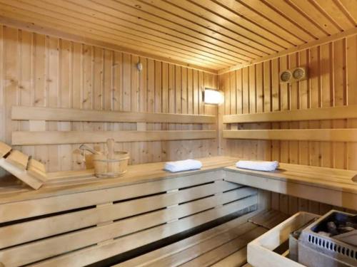 a sauna with wooden walls and a bench in it at Appartement Le Grau-du-Roi, 3 pièces, 6 personnes - FR-1-250-268 in Saint-André-Lachamp