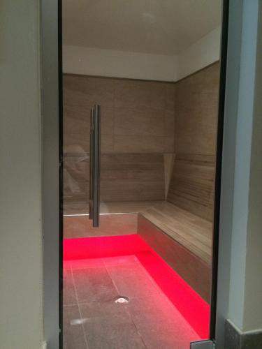 a room with a sauna with red led lights at Sport Hotel Prodongo in Brallo di Pregola