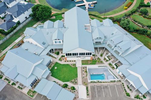 an aerial view of a house with white roofs at Harrington Marina in Harrington