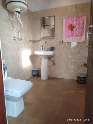 a bathroom with a sink and a toilet at ID VILLA in Gulmarg