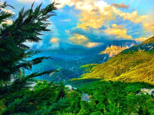 a view of a valley in the mountains at Zagori Suites Luxury Residences in Vitsa