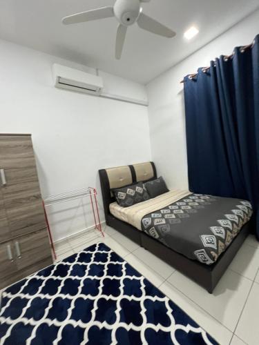 Ένα ή περισσότερα κρεβάτια σε δωμάτιο στο Linda Homestay Gong Badak UMT UnisZa Terengganu