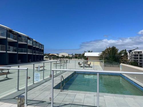 a swimming pool on the roof of a building at Apartment at The Entrance in The Entrance