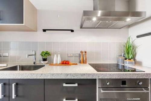 a kitchen with a sink and a counter top at Loft Apartment in Wellington