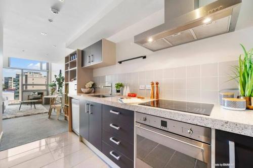 a kitchen with a sink and a counter top at Loft Apartment in Wellington