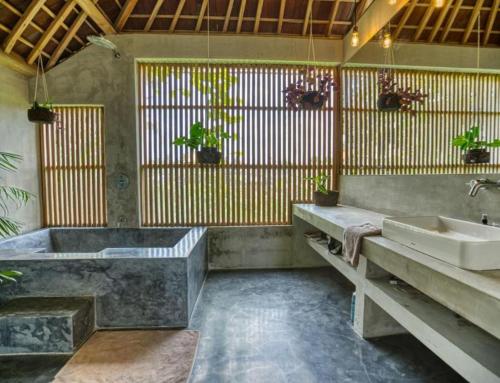 a bathroom with a large tub and a sink at Ubud Terrace by Hombali in Ubud