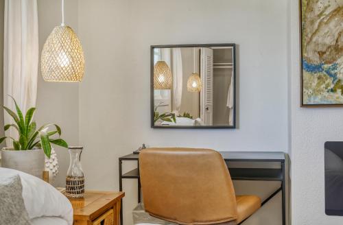 a bedroom with a desk and a chair and a mirror at Zen Haus Serene Retreat, prime location with views in Eugene