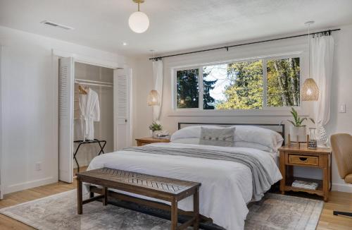 a bedroom with a large bed and a window at Zen Haus Serene Retreat, prime location with views in Eugene