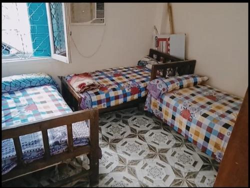 Ένα ή περισσότερα κρεβάτια σε δωμάτιο στο اسوان سحر الجنوب