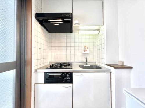 Una cocina o zona de cocina en Nishiwaseda
