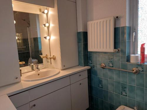 a bathroom with a sink and a mirror at BRUYERES - 3 pièces - Axelle Loc'Appart in Mandelieu-la-Napoule