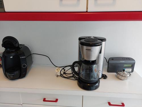 a coffee maker and a blender on a counter at BRUYERES - 3 pièces - Axelle Loc'Appart in Mandelieu-la-Napoule