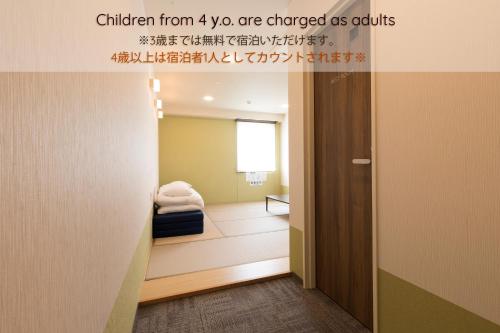 a hallway with a room with a bed at Wild Cherry Blossom-HOSTEL,TOKYO KOGANEI- in Koganei