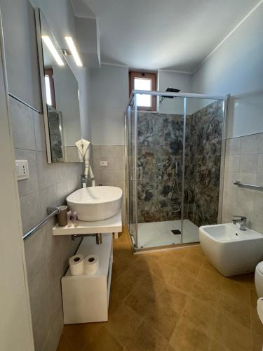 a bathroom with a sink and a shower at San Pietro Otranto in Otranto
