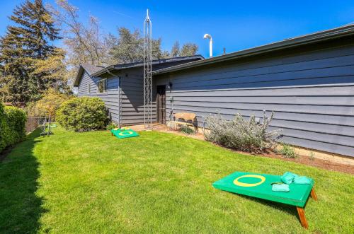 a yard with two frisbees on the grass at Zen Haus Serene Retreat, prime location with views in Eugene