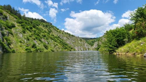 a river in the middle of a mountain at Etno meandri Uvca in Sjenica