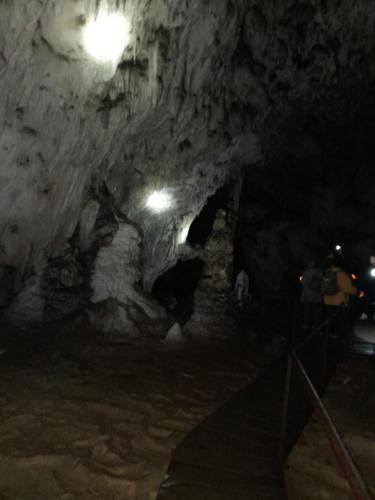 a dark cave with a light in it at night at Etno meandri Uvca in Sjenica