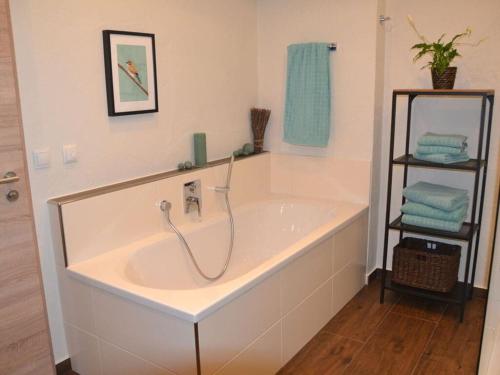 a large bath tub in a bathroom at Vakantieappartement in Berchtesgaden