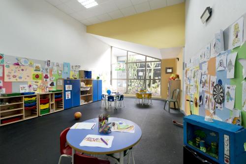 a classroom with a table and chairs in a room at Eurostars Las Salinas in Caleta De Fuste