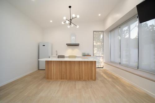 a kitchen with a island in the middle of a room at The Season Resort in Ban Chamrung