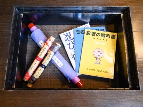 a box with four crayons and a book at Iga Ueno City Hotel in Iga