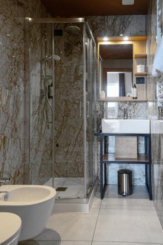 a bathroom with a shower and a sink at Hotel Arya by Mauro in Sirmione