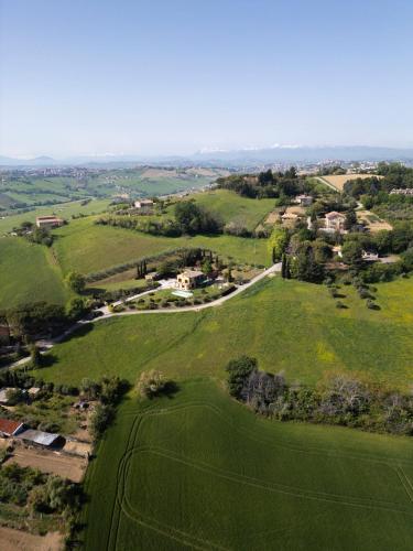an aerial view of a golf course in a green field at Villa Fortuna Belvedere in Montegranaro
