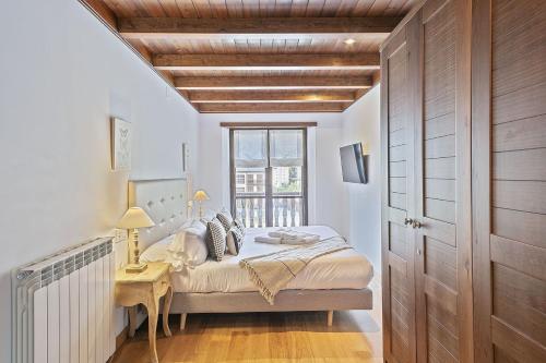 Ένα ή περισσότερα κρεβάτια σε δωμάτιο στο Luderna - Apartamento Val de Ruda A14 Montoliu