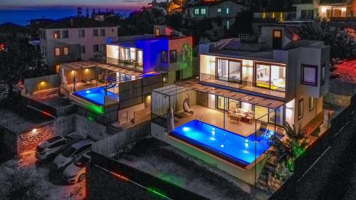 an aerial view of a house at night at Albedo Villa in Kas