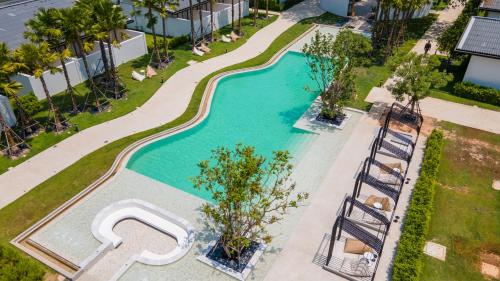 an overhead view of a swimming pool at a resort at The Season Resort in Ban Chamrung