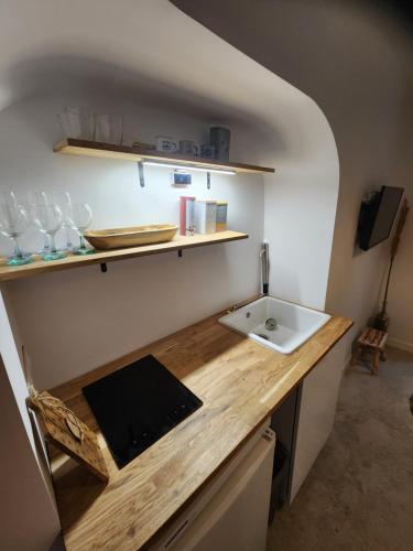 a kitchen with a sink and a counter top at Zen room - Havre de paix in Hyères