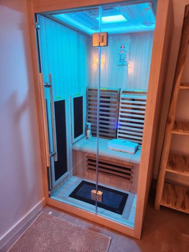 a shower with a glass door in a room at Zen room - Havre de paix in Hyères